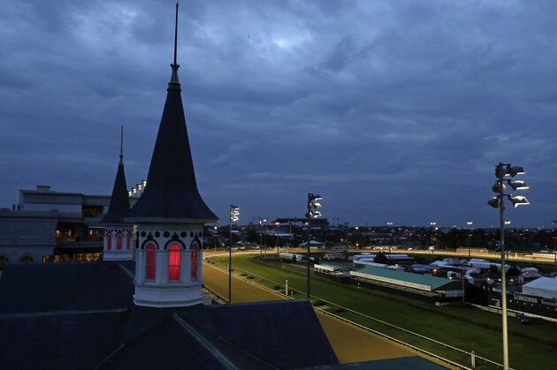 Horses train on the track before the 144th running of the Kentucky Oaks horse race at Churchill Downs Friday, May 4, 2018, in Louisville, Ky. The 144th Kentucky Derby is Saturday. (AP Photo/Darron Cummings)