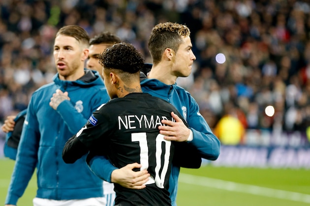 MADRID, SPAIN - FEBRUARY 14: Cristiano Ronaldo of Real Madrid hugs Neymar of Paris Saint-Germain during the UEFA Champions League Round of 16 First Leg match between Real Madrid and Paris Saint-Germain at Bernabeu on February 14, 2018 in Madrid, Spain. (Photo by TF-Images/ Getty Images)
