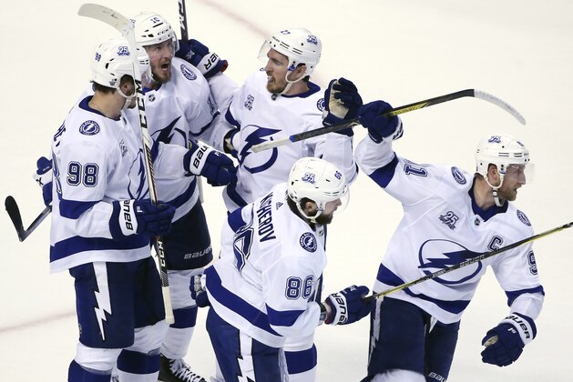 Tampa Bay Lightning center Steven Stamkos, far right, heads to the bench after celebrating his goal with teammates the third period of Game 4 against the Boston Bruins in an NHL hockey second-round playoff series, Friday, May 4, 2018, in Boston. (AP Photo/Elise Amendola)