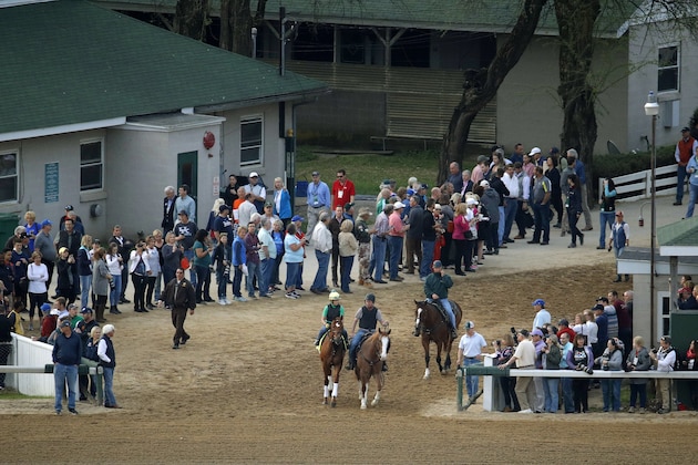 Horses are led out onto the track during training for Kentucky Derby entrants at Churchill Downs, Wednesday, May 2, 2018, in Louisville, Ky. The 144th running of the Kentucky Derby is scheduled for Saturday, May 5. (AP Photo/Charlie Riedel)