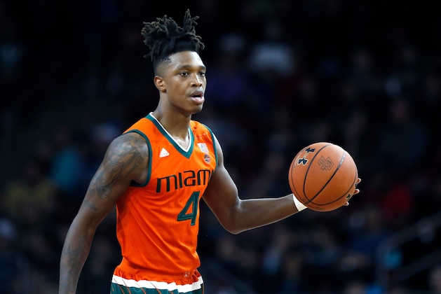 FILE - In this Feb. 10, 2018, file photo, Miami's Lonnie Walker IV brings the ball up against Boston College during the second half of an NCAA college basketball game in Boston. Walker says he'll turn pro this year, a move anticipated even before his college career began. Walker announced Wednesday, April 4, on Twitter that he'll hire an agent, which will prevent him from returning to the Hurricanes, and plans to enter the NBA draft. Many projections list him as a lottery pick. (AP Photo/Michael Dwyer, File)