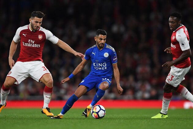 LONDON, ENGLAND - AUGUST 11:  Riyad Mahrez of Leicester City is closed down by Sead Kolasinac (L) and Danny Welbeck (R) of Arsenal during the Premier League match between Arsenal and Leicester City at the Emirates Stadium on August 11, 2017 in London, England.  (Photo by Shaun Botterill/Getty Images)