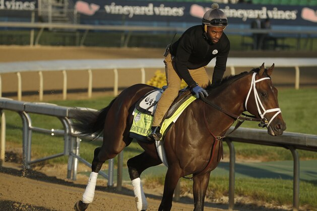 Kentucky Derby hopeful Magnum Moon runs during a morning workout at Churchill Downs Tuesday, May 1, 2018, in Louisville, Ky. The 144th running of the Kentucky Derby is scheduled for Saturday, May 5. (AP Photo/Charlie Riedel)