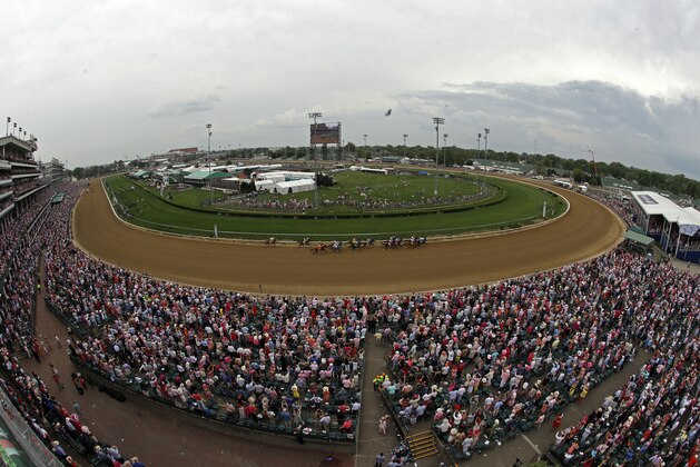 Horses run out of the first turn during the 144th running of the Kentucky Oaks horse race at Churchill Downs Friday, May 4, 2018, in Louisville, Ky. (AP Photo/Charlie Riedel)