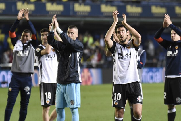 Valencia's players acknowledge fans at the end of the Spanish league football match between Villarreal and Valencia at the La Ceramica stadium in Villarreal on May 5, 2018. (Photo by JOSE JORDAN / AFP)        (Photo credit should read JOSE JORDAN/AFP/Getty Images)