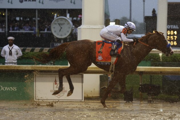 Mike Smith rides Justify to victory during the 144th running of the Kentucky Derby horse race at Churchill Downs Saturday, May 5, 2018, in Louisville, Ky. (AP Photo/Kiichiro Sato)
