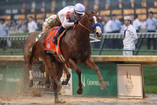 LOUISVILLE, KY - MAY 05:  Justify #7, ridden by jockey Mike Smith crosses the finish line to win the 144th running of the Kentucky Derby at Churchill Downs on May 5, 2018 in Louisville, Kentucky.  (Photo by Rob Carr/Getty Images)