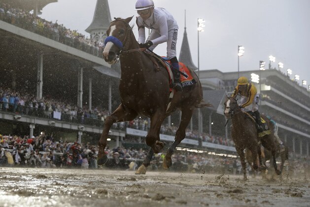 Mike Smith rides Justify to victory during the 144th running of the Kentucky Derby horse race at Churchill Downs Saturday, May 5, 2018, in Louisville, Ky. (AP Photo/Morry Gash)