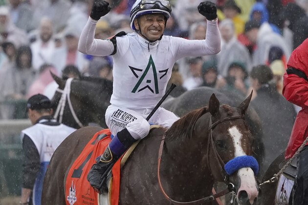 Mike Smith celebrates after riding Justify to victory during the 144th running of the Kentucky Derby horse race at Churchill Downs Saturday, May 5, 2018, in Louisville, Ky. (AP Photo/Morry Gash)