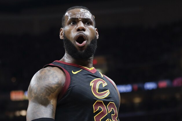 Cleveland Cavaliers' LeBron James (23) reacts after dunking against the Toronto Raptors in the first half of Game 3 of an NBA basketball second-round playoff series, Saturday, May 5, 2018, in Cleveland. (AP Photo/Tony Dejak)