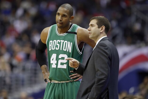 Boston Celtics center Al Horford (42), from the Dominican Republic, and head coach Brad Stevens talk in the first half of game 6 of the Eastern Conference semifinal NBA basketball playoff series against the Washington Wizards, Friday, May 12, 2017, in Washington. (AP Photo/Alex Brandon)