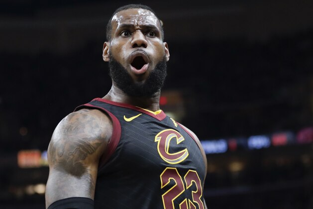 Cleveland Cavaliers' LeBron James (23) reacts after dunking against the Toronto Raptors in the first half of Game 3 of an NBA basketball second-round playoff series, Saturday, May 5, 2018, in Cleveland. (AP Photo/Tony Dejak)