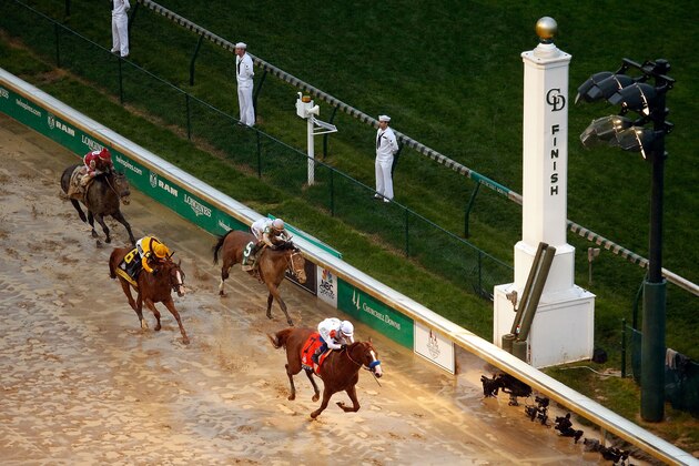 LOUISVILLE, KY - MAY 05:  Justify #7, ridden by jockey Mike Smith, crosses the finish line to win the 144th running of the Kentucky Derby at Churchill Downs on May 5, 2018 in Louisville, Kentucky.  (Photo by Jamie Squire/Getty Images)