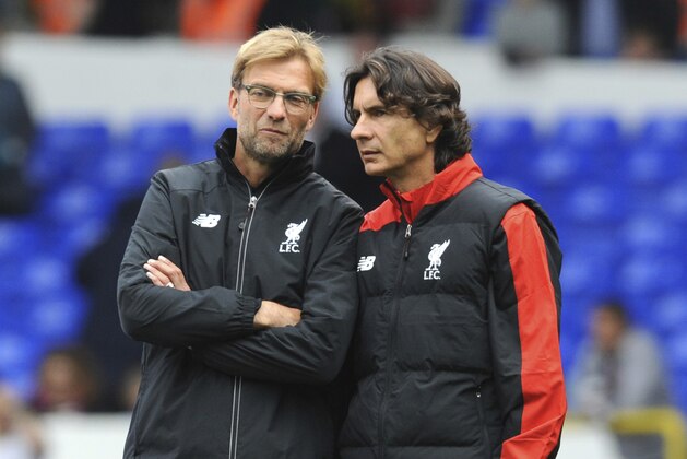 FILE - In this file photo dated Saturday, Oct. 17, 2015, Liverpool manager Juergen Klopp, left, talks with assistant manager Zeljko Buvac before their English Premier League soccer match against Tottenham Hotspur at the White Hart Lane in London. Liverpool’s assistant coach Buvac, is spending some time away from the team until the end of the season for personal reasons, it is announced Monday April 30, 2018, potentially disrupting the team’s bid to qualify for the Champions League final this week. (AP Photo/Rui Vieira, FILE)