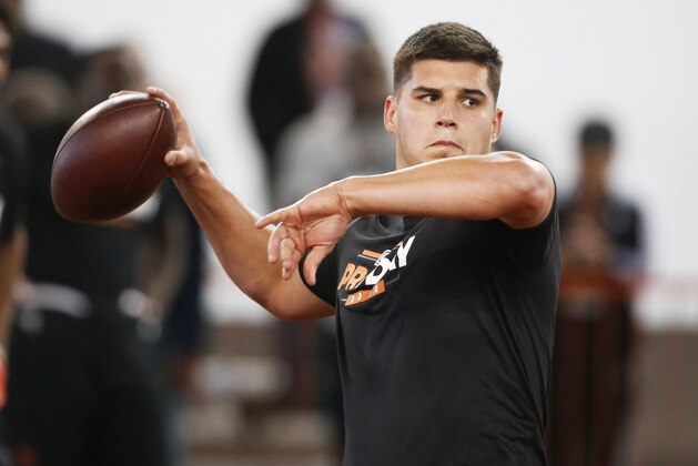 Oklahoma State quarterback Mason Rudolph passes during Pro Day for NFL football scouts in Stillwater, Okla., Thursday, March 15, 2018. (AP Photo/Sue Ogrocki)