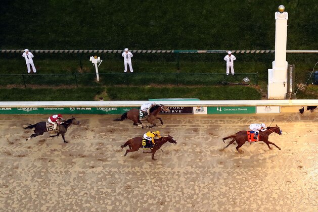 LOUISVILLE, KY - MAY 05:  Justify #7, ridden by jockey Mike Smith, crosses the finish line to win the 144th running of the Kentucky Derby at Churchill Downs on May 5, 2018 in Louisville, Kentucky.  (Photo by Jamie Squire/Getty Images)