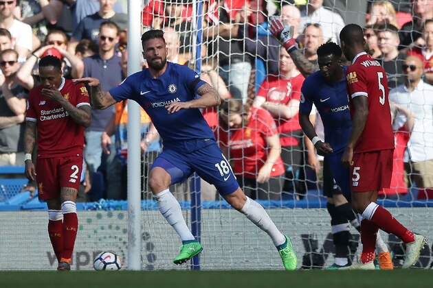 Chelsea's French striker Olivier Giroud (2L) celebrates scoring the opening goal during the English Premier League football match between Chelsea and Liverpool at Stamford Bridge in London on May 6, 2018. (Photo by Daniel LEAL-OLIVAS / AFP) / RESTRICTED TO EDITORIAL USE. No use with unauthorized audio, video, data, fixture lists, club/league logos or 'live' services. Online in-match use limited to 75 images, no video emulation. No use in betting, games or single club/league/player publications. /         (Photo credit should read DANIEL LEAL-OLIVAS/AFP/Getty Images)