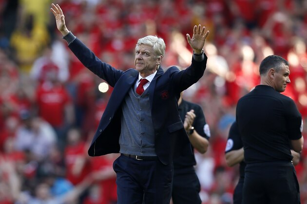 Arsenal's French manager Arsene Wenger salutes the crowd as he arrives for the English Premier League football match between Arsenal and Burnley at the Emirates Stadium in London on May 6, 2018. - Arsene Wenger bids farewell to a stadium he helped to build in more ways than one when he leads Arsenal at the Emirates for the final time at home to Burnley on Sunday. Wenger's final season after 22 years in charge is destined to end in disappointment after Thursday's Europa League semi-final exit. (Photo by Ian KINGTON / IKIMAGES / AFP) / RESTRICTED TO EDITORIAL USE. No use with unauthorized audio, video, data, fixture lists, club/league logos or 'live' services. Online in-match use limited to 45 images, no video emulation. No use in betting, games or single club/league/player publications. /         (Photo credit should read IAN KINGTON/AFP/Getty Images)