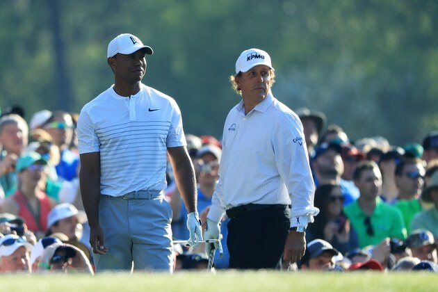 AUGUSTA, GA - APRIL 03:  Tiger Woods and Phil Mickelson of the United States look on from the 12th tee during a practice round prior to the start of the 2018 Masters Tournament at Augusta National Golf Club on April 3, 2018 in Augusta, Georgia.  (Photo by Andrew Redington/Getty Images)