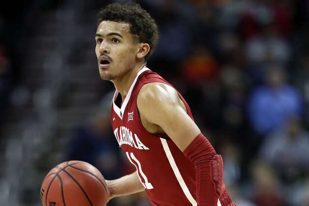 KANSAS CITY, MO - MARCH 07:  Trae Young #11 of the Oklahoma Sooners controls the ball during the first round of the Big 12 Basketball Tournament against the Oklahoma State Cowboys at the Sprint Center on March 7, 2018 in Kansas City, Missouri.  (Photo by Jamie Squire/Getty Images)
