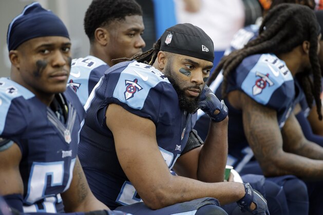 Tennessee Titans safety Michael Griffin, center, sits on the bench in the final minutes of the fourth quarter during their 34-6 loss to the Houston Texans in an NFL football game Sunday, Dec. 27, 2015, in Nashville, Tenn. (AP Photo/James Kenney)