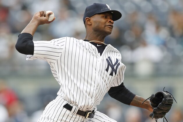New York Yankees starting pitcher Domingo German delivers during the first inning of a baseball game against the Cleveland Indians in New York, Sunday, May 6, 2018. (AP Photo/Kathy Willens)