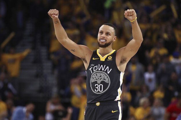 Golden State Warriors' Stephen Curry (30) celebrates a score against the New Orleans Pelicans during the second half in Game 2 of a second-round NBA basketball playoff series Tuesday, May 1, 2018, in Oakland, Calif. (AP Photo/Ben Margot)