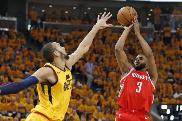 Utah Jazz center Rudy Gobert (27) defends against Houston Rockets guard Chris Paul (3) during the first half in Game 4 of an NBA basketball second-round playoff series Sunday, May 6, 2018, in Salt Lake City. (AP Photo/Rick Bowmer)