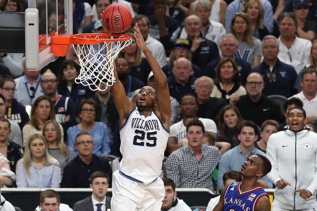 SAN ANTONIO, TX - MARCH 31: Mikal Bridges #25 of the Villanova Wildcats goes up for a dunk in the second half against Lagerald Vick #2 of the Kansas Jayhawks during the 2018 NCAA Men's Final Four Semifinal at the Alamodome on March 31, 2018 in San Antonio, Texas.  (Photo by Chris Covatta/Getty Images)