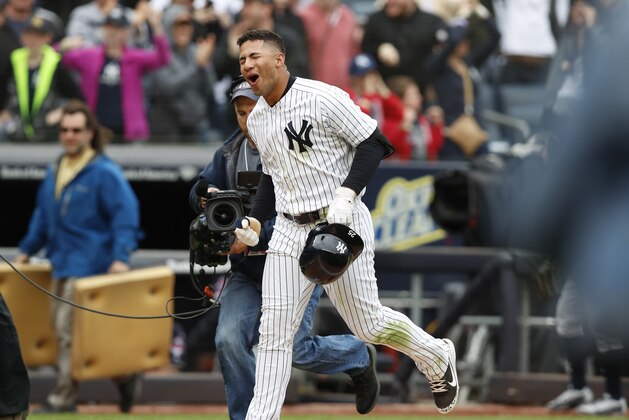 New York Yankees' Gleyber Torres reacts as he runs home on his ninth-inning, walk-off, three-run, home run against the Cleveland Indians in a baseball game in New York, Sunday, May 6, 2018. The Yankees won 7-4. (AP Photo/Kathy Willens)