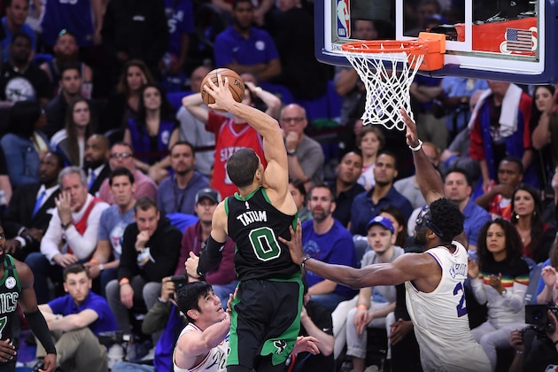 PHILADELPHIA, PA - MAY 5: Jayson Tatum #0 of the Boston Celtics attempts a dunk against Joel Embiid #21 of the Philadelphia 76ers in Game Three of the Eastern Conference Semifinals of the 2018 NBA Playoffs at Wells Fargo Center on May 5, 2018 in Philadelphia, Pennsylvania. NOTE TO USER: User expressly acknowledges and agrees that, by downloading and or using this photograph, User is consenting to the terms and conditions of the Getty Images License Agreement. (Photo by Matteo Marchi/Getty Images) *** Local Caption *** Jayson Tatum; Joel Embiid