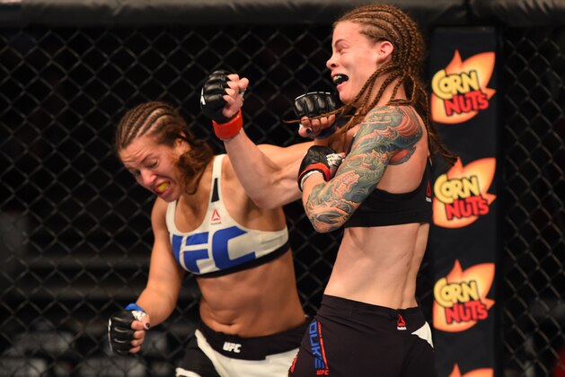 CHICAGO, IL - JULY 25:   (L-R) Elizabeth Phillips and Jessamyn Duke trade punches in their women's bantamweight bout during the UFC event at the United Center on July 25, 2015 in Chicago, Illinois. (Photo by Jeff Bottari/Zuffa LLC/Zuffa LLC via Getty Images)