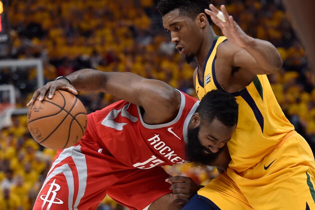 SALT LAKE CITY, UT - MAY 06: James Harden #13 of the Houston Rockets drives into defender Donovan Mitchell #45 of the Utah Jazz in the second half during Game Four of Round Two of the 2018 NBA Playoffs at Vivint Smart Home Arena on May 6, 2018 in Salt Lake City, Utah. The Rockets beat the Jazz 100-87. NOTE TO USER: User expressly acknowledges and agrees that, by downloading and or using this photograph, User is consenting to the terms and conditions of the Getty Images License Agreement. (Photo by Gene Sweeney Jr./Getty Images)