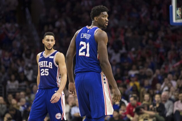 Philadelphia 76ers' Joel Embiid, of Cameroon, right, looks back with Ben Simmons, of Australia, left, near by during the second half of an NBA basketball game against the Indiana Pacers, Friday, Nov. 3, 2017, in Philadelphia. The 76ers won 121-110. (AP Photo/Chris Szagola)