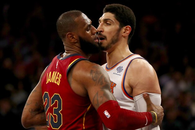 NEW YORK, NY - NOVEMBER 13:  LeBron James #23 of the Cleveland Cavaliers and Enes Kanter #00 of the New York Knicks exchange words in the first half at Madison Square Garden on November 13, 2017 in New York City. NOTE TO USER: User expressly acknowledges and agrees that, by downloading and or using this Photograph, user is consenting to the terms and conditions of the Getty Images License Agreement  (Photo by Elsa/Getty Images)