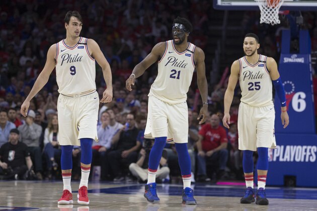 PHILADELPHIA, PA - MAY 7: Dario Saric #9, Joel Embiid #21, and Ben Simmons #25 of the Philadelphia 76ers look on in the fourth quarter against the Boston Celtics during Game Four of the Eastern Conference Second Round of the 2018 NBA Playoffs at Wells Fargo Center on May 7, 2018 in Philadelphia, Pennsylvania. The 76ers defeated the Celtics 103-92. NOTE TO USER: User expressly acknowledges and agrees that, by downloading and or using this photograph, User is consenting to the terms and conditions of the Getty Images License Agreement. (Photo by Mitchell Leff/Getty Images)