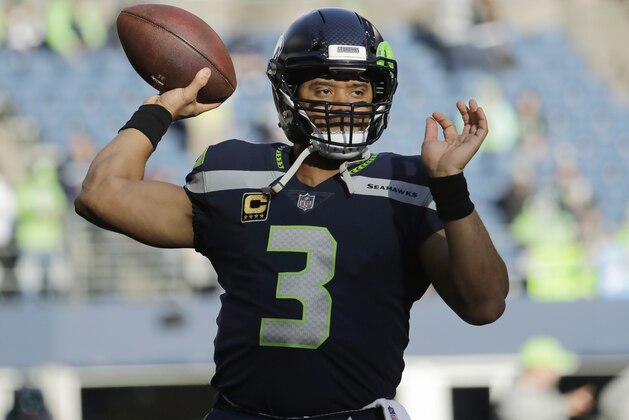 Seattle Seahawks quarterback Russell Wilson passes during warmups before an NFL football game against the Arizona Cardinals, Sunday, Dec. 31, 2017, in Seattle. (AP Photo/Elaine Thompson) Seattle Seahawks quarterback Russell Wilson passes during warmups before an NFL football game against the Arizona Cardinals, Sunday, Dec. 31, 2017, in Seattle. (AP Photo/Elaine Thompson)