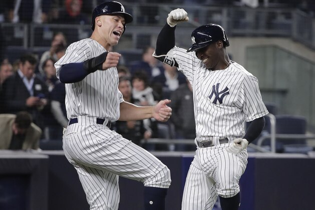 New York Yankees' Didi Gregorius, right, celebrates with Aaron Judge after hitting a two-run home run against the Minnesota Twins during the fifth inning of a baseball game, Tuesday, April 24, 2018, in New York. (AP Photo/Julie Jacobson)