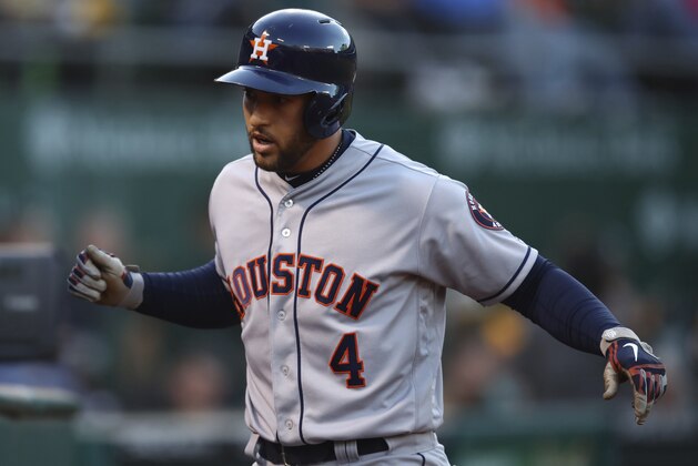 Houston Astros' George Springer celebrates after hitting a three run home run off Oakland Athletics' Brett Anderson during the second inning of a baseball game Monday, May 7, 2018, in Oakland, Calif. (AP Photo/Ben Margot)
