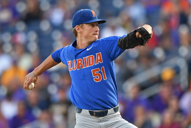 Omaha, NE - JUNE 26:  Pitcher Brady Singer #51 of the Florida Gators delivers a pitch against the LSU Tigers in the first inning during game one of the College World Series Championship Series on June 26, 2017 at TD Ameritrade Park in Omaha, Nebraska.  (Photo by Peter Aiken/Getty Images)