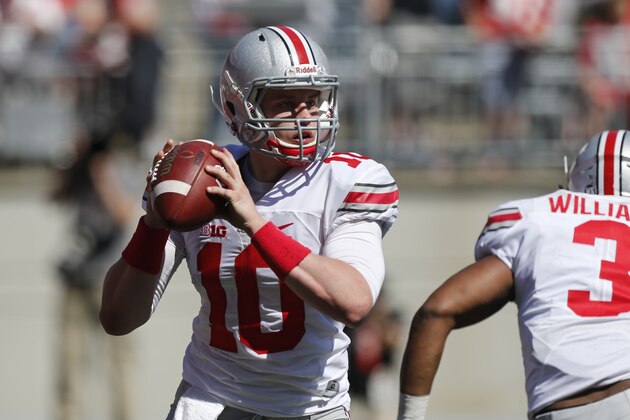 Ohio State quarterback Joe Burrow plays in Ohio State's NCAA college football spring game Saturday, April 16, 2016, in Columbus, Ohio. (AP Photo/Jay LaPrete)
