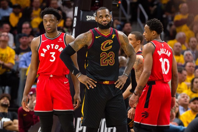 CLEVELAND, OH - MAY 7: LeBron James #23 of the Cleveland Cavaliers reacts to a call by officials as OG Anunoby #3 of the Toronto Raptors looks on during the first half of Game 4 of the second round of the Eastern Conference playoffs at Quicken Loans Arena on May 7, 2018 in Cleveland, Ohio. NOTE TO USER: User expressly acknowledges and agrees that, by downloading and or using this photograph, User is consenting to the terms and conditions of the Getty Images License Agreement. (Photo by Jason Miller/Getty Images)