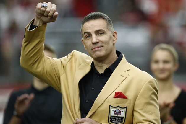 Former Arizona Cardinals quarterback Kurt Warner shows his Football Hall of Fame ring during his ring ceremony at half time of an NFL football game against the San Francisco 49ers, Sunday, Oct. 1, 2017, in Glendale, Ariz. (AP Photo/Ross D. Franklin)