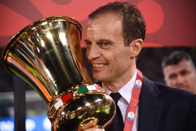 Juventus' coach from Italy Massimiliano Allegri poses with the trophy after winning the Italian Tim Cup final on May 17, 2017 at the Olympic stadium in Rome. Dani Alves and Leonardo Bonucci struck one apiece as treble-chasing Juventus secured a third successive Italian Cup with a 2-0 victory over Lazio at the Stadio Olimpico today.


Juventus, who won a league and Cup double the past two seasons, can clinch a record sixth consecutive Serie A title -- and a record third successive double -- with victory at home to Crotone in their penultimate Serie A game of the season on Sunday.
 / AFP PHOTO / FILIPPO MONTEFORTE        (Photo credit should read FILIPPO MONTEFORTE/AFP/Getty Images)
