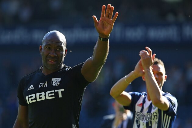 West Bromwich Albion's caretaker manager Darren Moore applauds the fans following the English Premier League football match between West Bromwich Albion and Tottenham Hotspur at The Hawthorns stadium in West Bromwich, central England, on May 5, 2018. - West Bromwhich won the match 1-0. (Photo by Geoff CADDICK / AFP) / RESTRICTED TO EDITORIAL USE. No use with unauthorized audio, video, data, fixture lists, club/league logos or 'live' services. Online in-match use limited to 75 images, no video emulation. No use in betting, games or single club/league/player publications. /         (Photo credit should read GEOFF CADDICK/AFP/Getty Images)