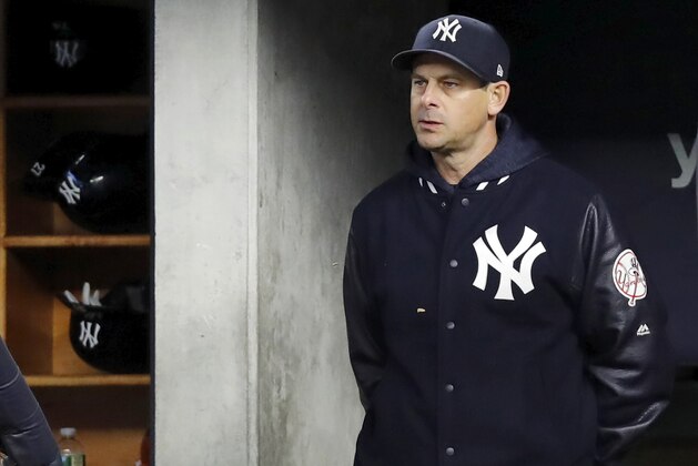 NEW YORK, NY - APRIL 24:  Manager Aaron Boone #17 of the New York Yankees watches his team from the dugout in an MLB baseball game against the Minnesota Twins on April 24, 2018 at Yankee Stadium in the Bronx borough of New York City. Yankees won 8-3. (Photo by Paul Bereswill/Getty Images)