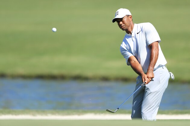 PONTE VEDRA BEACH, FL - MAY 08:  Tiger Woods of the United States plays a shot from a bunker during practice rounds prior to THE PLAYERS Championship on the Stadium Course at TPC Sawgrass on May 8, 2018 in Ponte Vedra Beach, Florida.  (Photo by Sam Greenwood/Getty Images)
