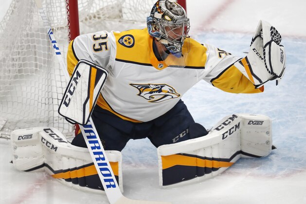 Nashville Predators goaltender Pekka Rinne makes a glove save against the Colorado Avalanche during the first period of Game 4 of an NHL hockey first-round playoff series Wednesday, April 18, 2018, in Denver. (AP Photo/David Zalubowski)