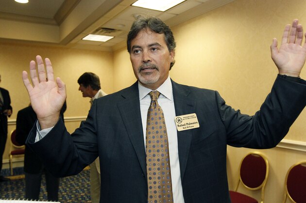 Former major league baseball player Rafael Palmeiro speaks about his legacy as a ball player following 20 years in the majors at a reception before his induction to the Mississippi Sports Hall of Fame, Friday night, July 27, 2012, in Jackson, Miss. Palmeiro, a Mississippi State graduate is one of only four players to hit more than 500 home runs and slug more than 3,000 hits during his career.   (AP Photo/Rogelio V. Solis)