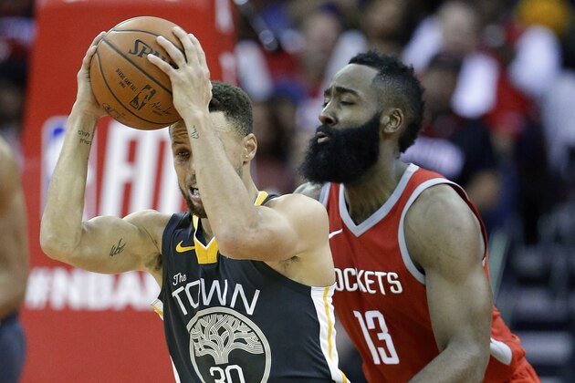 Golden State Warriors guard Stephen Curry (30) looks to pass the ball under pressure from Houston Rockets guard James Harden (13) during the second half of an NBA basketball game Saturday, Jan. 20, 2018, in Houston. (AP Photo/Michael Wyke)